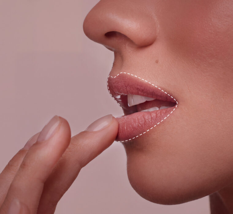 Close-up of a person touching the lower lip, outlined to indicate altered sensation